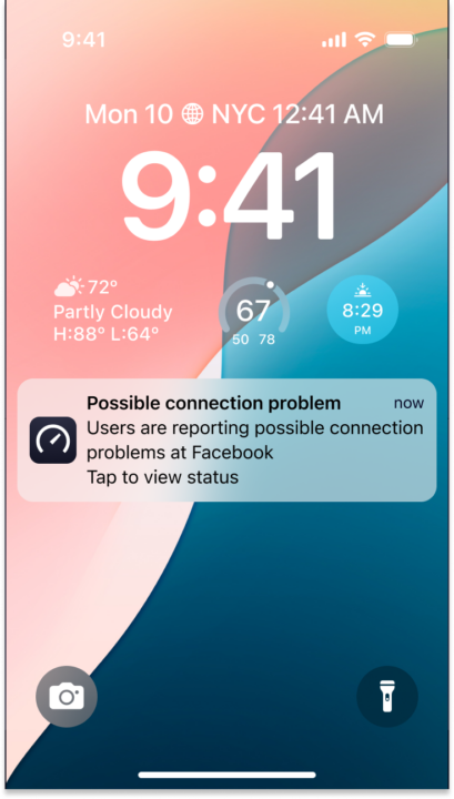 phone lock screen with Downdetector push notification
